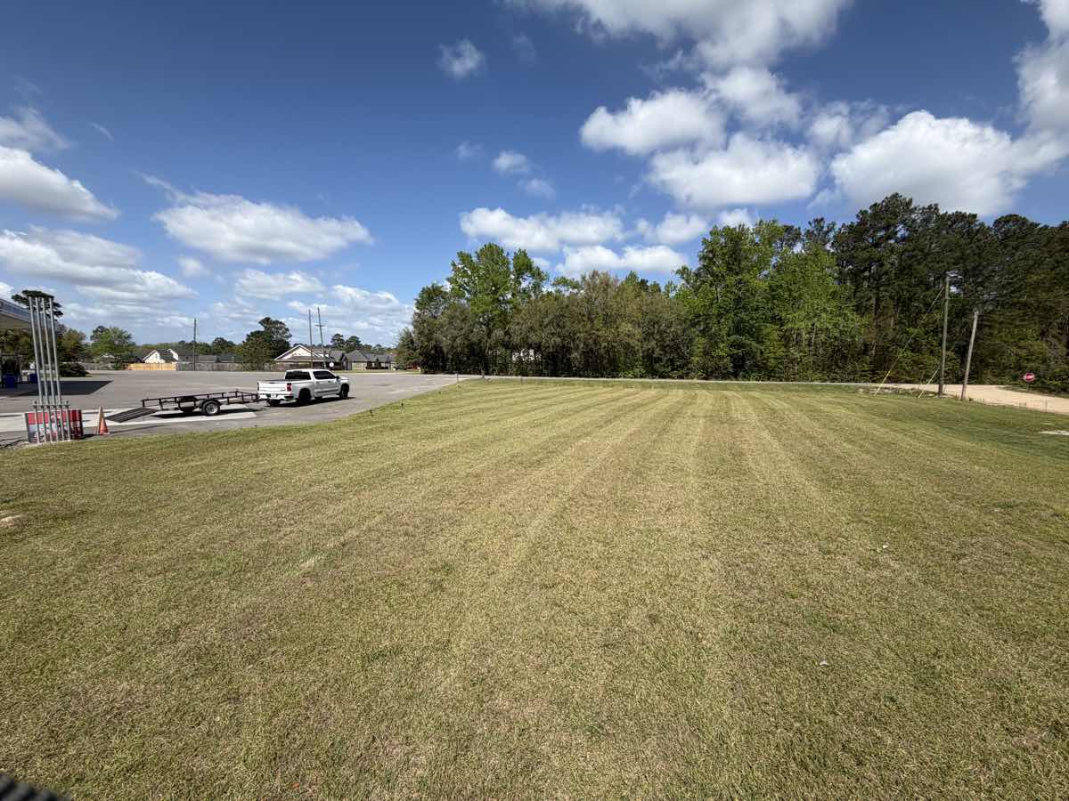 Commercial lawn with professional mowing stripes by A&P Lawn Care in Hinesville, GA
